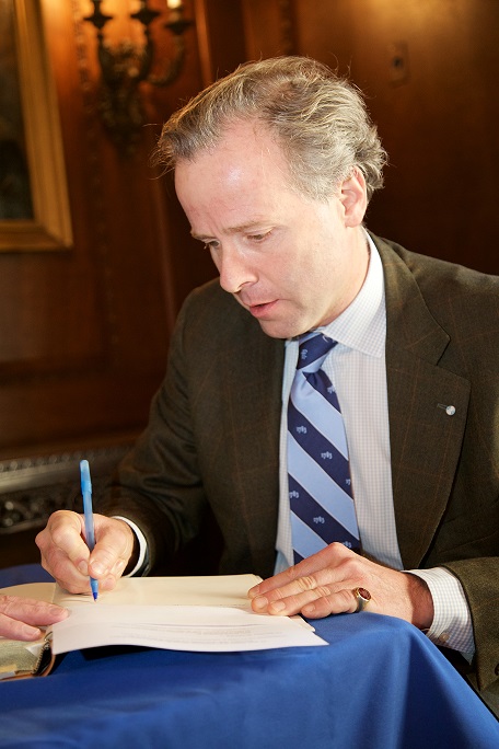 Signing the membership book